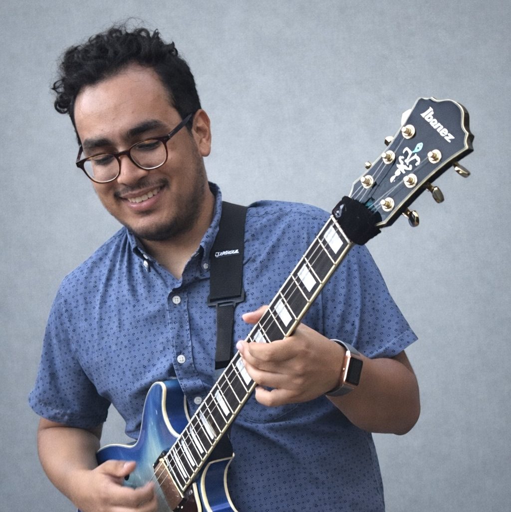 musician playing the guitar